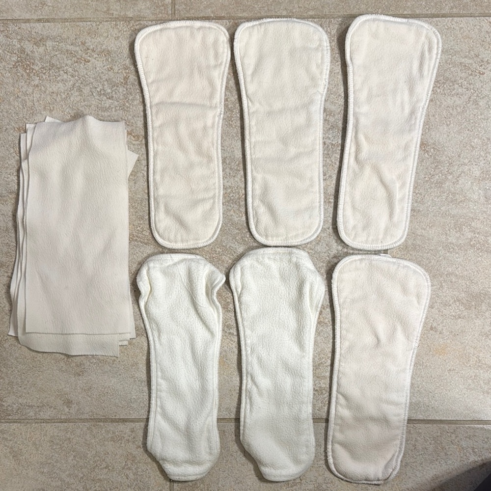 6 esembly overnight cloth diaper boosters and 8 stay dry liners
